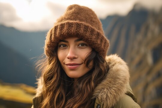 Photography in the style of pensive portraiture of a happy girl in her 20s wearing a warm trapper hat at the machu picchu in cusco region peru. With generative AI technology