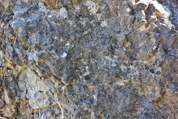 Texture of flint rock interspersed with basalt and marble. Ancient rocks texture of inclusions and...