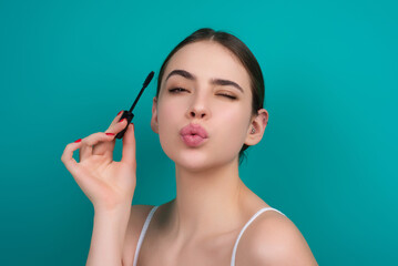 Woman with long eyelashes hold eyelashes brush. Eyelashes lamination. Lashes beauty procedures....