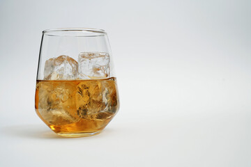 Whiskey alcohol drink cocktail with ice in a bar
