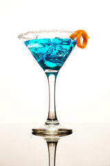 Cocktail drink blue with ice and fruit isolated at white 