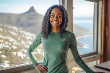 Photo sur Plexiglas Montagne de la Table Lifestyle portrait photography of a happy girl in her 30s wearing a long-sleeved thermal undershirt at the table mountain in cape town south africa. With generative AI technology