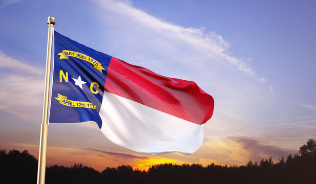 Flag of North Carolina against the sunset