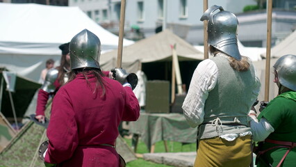 Guardians of the Past, Soldiers Poised with Spears at Reenactment Festiva. Soldiers with steel...