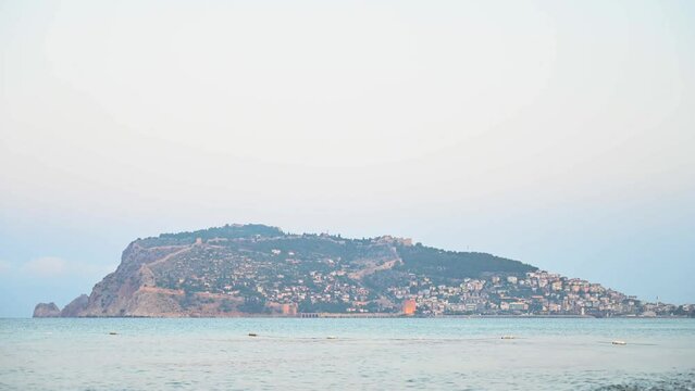 Beautiful sundawn scene on Alanya beach with view to famous Alanya island, in Turkey