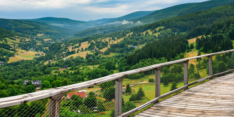 Obraz premium Sky Walk, an observation tower in Swieradow Zdroj. View of the mountain valley from the upper terrace at the top of the tower.