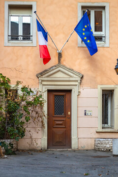 Door with flags of an official french building in Cotignac, France