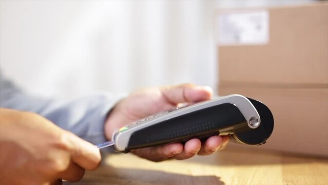 Man paying by credit card in shop