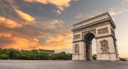 Famous Arc de Triomphe against nice blue sky Arc de Triomphe monument at at the western end of the...