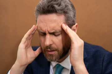 Fototapeta premium Business man feel pain holding glasses rubbing dry irritated eyes fatigued from computer work, stressed man suffer from headache bad vision sight problem sit at office. Deadline and stressed job.