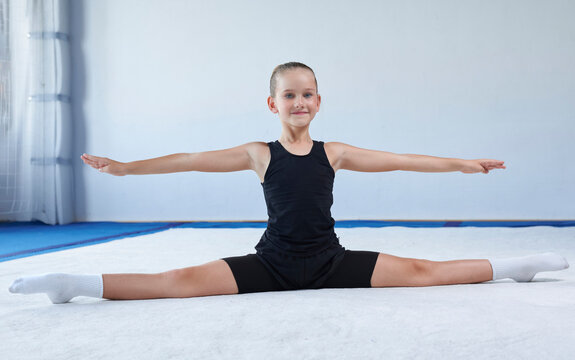 Image of a little girl in the gym. Gymnastics concept.