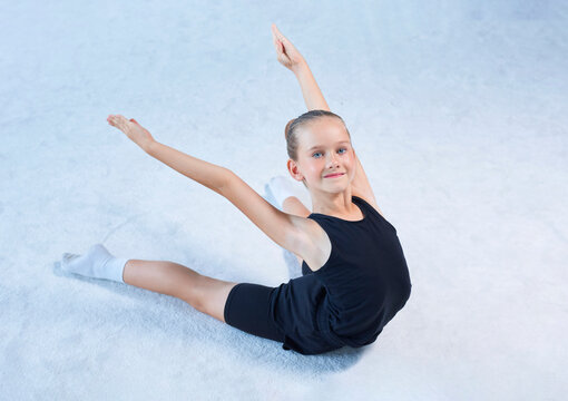 Image of a little girl in the gym. Gymnastics concept.