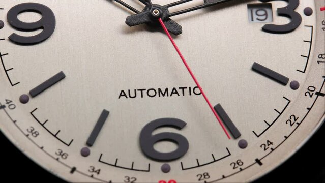 Stylish Luxury Man Wrist Watch With Moving Hand And Multiple Dials. Men's watch in metal with sapphire crystal. Closeup view of rotating watch, running second arrow. Cyclops watch