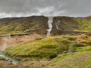 Mossy and wetland terrain of Reykjadalur Valley, Iceland. Valley is known for its mudpots, soda springs and geothermal activity.