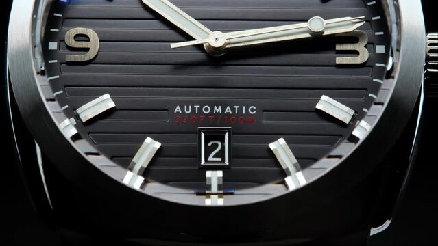 Stylish Luxury Man Wrist Watch With Moving Hand And Multiple Dials. Men's watch in metal with sapphire crystal. Closeup view of rotating watch, running second arrow. Cyclops watch