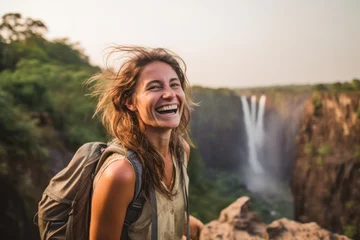 Foto op Aluminium Medium shot portrait photography of a joyful girl in her 30s wearing a rugged jean vest at the victoria falls in livingstone zambia. With generative AI technology © Markus Schröder