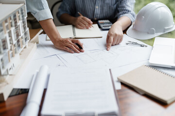 Architect working on the desk, construction project ideas architecture engineer Concept..