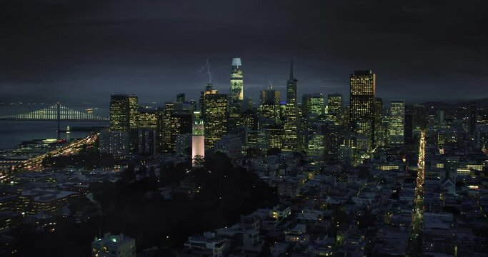 
Aerial San Francisco at Night, City Skyline with Lightning Flashes. Traffic. Thunderstorm. Climate Change. Shot in 8K.