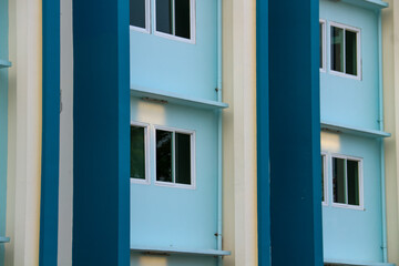 Colorful windows on the facade of a building in the city.