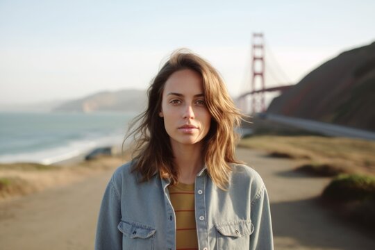 Medium shot portrait photography of a merry girl in her 20s wearing a simple cotton shirt at the golden gate bridge in san francisco usa. With generative AI technology