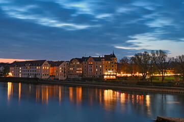 Beautiful old buildings at night in Regensburg Germany
