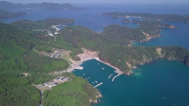 Japan's coastline with harbor from aerial drone shot