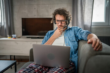 One man caucasian male freelancer work from home on laptop computer