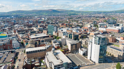Fototapeta na wymiar Aerial view on buildings and Lagan River in City center of Belfast Northern Ireland. Drone photo, high angle view of town