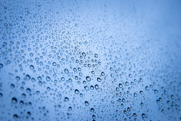 a close up of water droplets on a glass