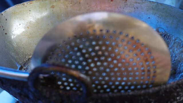 Tea snack, frying spoon, deep fried oily unhealthy food. home made recipe. Early morning breakfast. street food, pakoda, pakode.