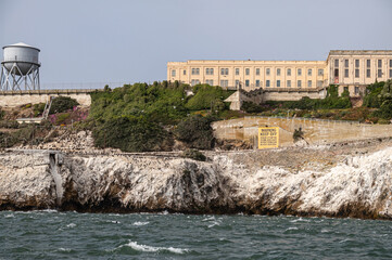 San Francisco, CA, USA - July 12, 2023: Alcatraz Island NW  rocky shore detail, guano covered...