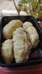 Durian is a kind of Indonesian fruit. Durian that has been peeled and packaged in food boxes. typical Indonesian fruit. Asian fruits