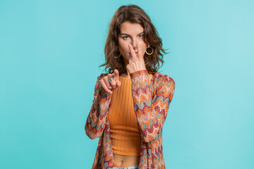 I am watching you. Young confident woman pointing at her eyes and camera, show I am watching you...