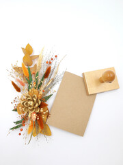 Flatley of yellow flowers on white background , beige envelope and seal, top view, space for text. Decor, welcome card. High quality photo