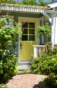 sunny front porch of old fashioned beach bungalow