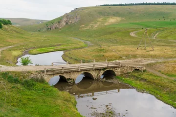 Fototapete Landwasserviadukt Bridge over river. Background with selective focus and copy space