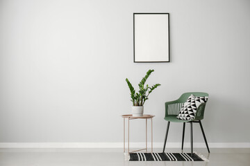Green plant on table and chair in light room