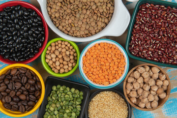 assorted bowls with raw grain and seeds top view