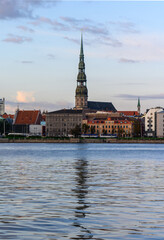 Fototapeta na wymiar St. Peter's Cathedral in Old Riga view across the Daugava river