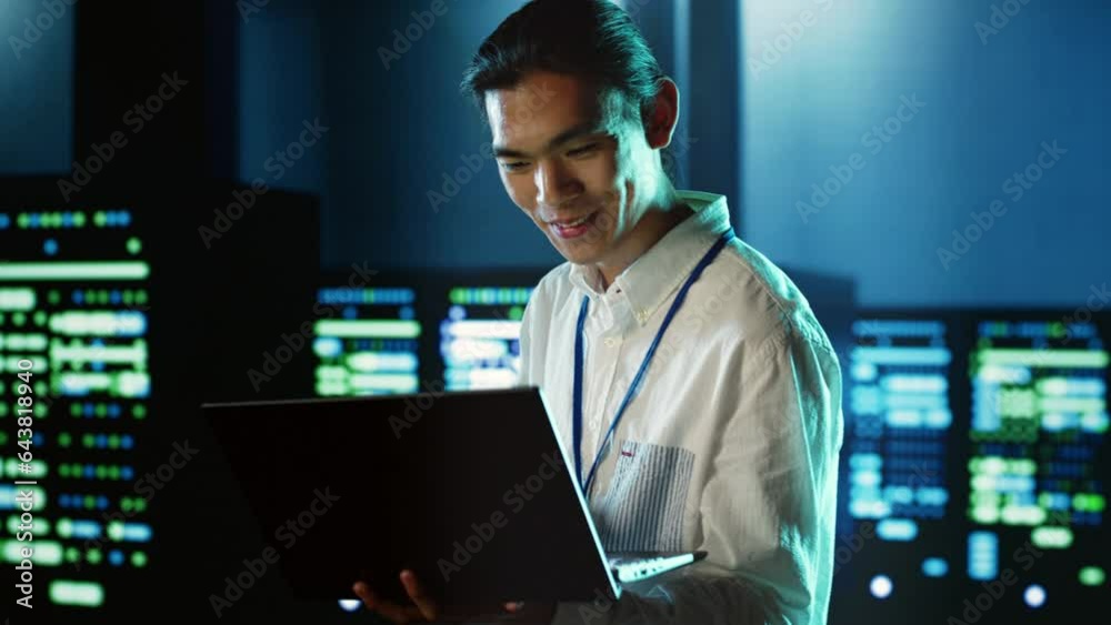 Poster computer scientist strolling through server rows providing processing resources for different worklo