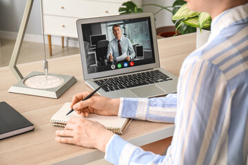 Young woman having job interview online at home, closeup