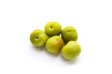 Fresh green plum on white background