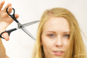 Girl with scissors thinning shears