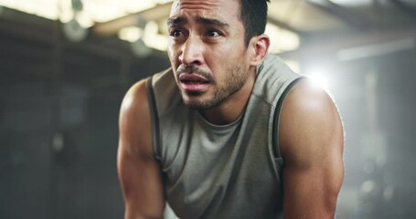 Sweat, fitness and man tired from gym, workout or rest in training in cardio, sports and body builder breathing with fatigue. Exhausted, break and athlete with commitment for health challenge