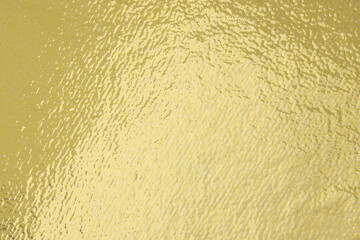 Edible gold leaf sheet as background, closeup