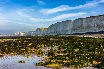 The Seven Sisters are a series of chalk sea cliffs on the English Channel coast, and are a stretch of the sea-eroded section of the South Downs range of hills, in the county of East Sussex, UK.