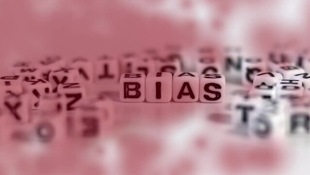 Miniature glasses and white cube with BIAS on it. The concept of social bias to stop.

