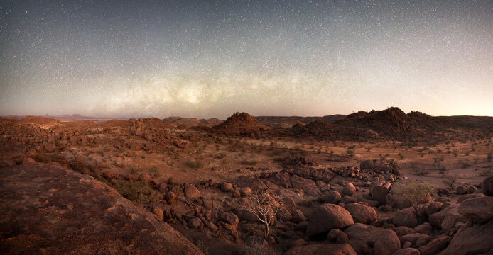 The Milkyway core sets over the boulder strewn landscape of Damaland, Namibia.