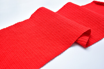 wavy of red wool knitted yarn texture, woolen fabric on white background
