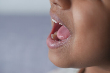 close up of child screaming at home 